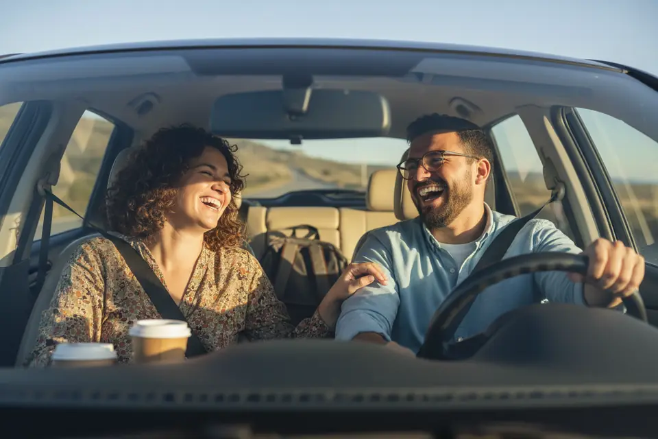 A driver and passenger sharing an easy morning ride